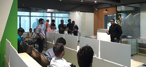 A person giving speech to employees